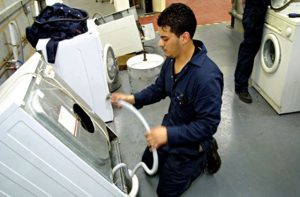 re use: repairing a discarded washing machine.